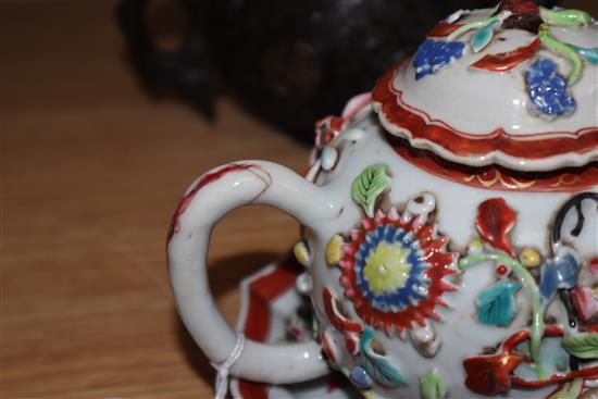 An 18th century Chinese Export famille rose teapot, cover and a similar dish